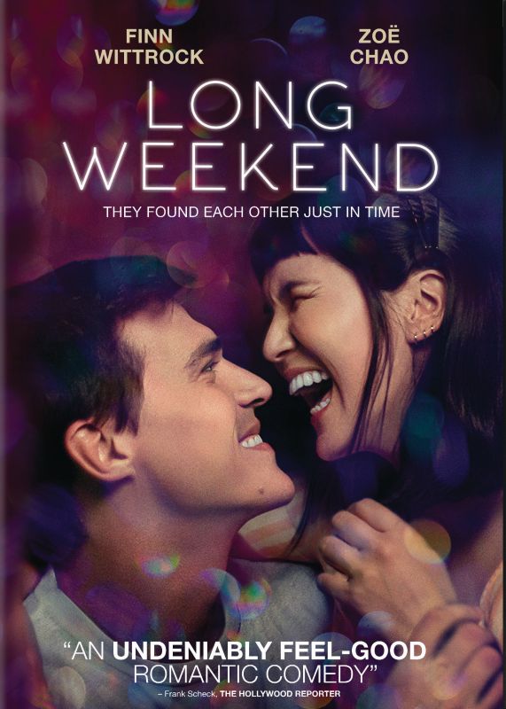 couple smiling on a purple background with long weekend written on top