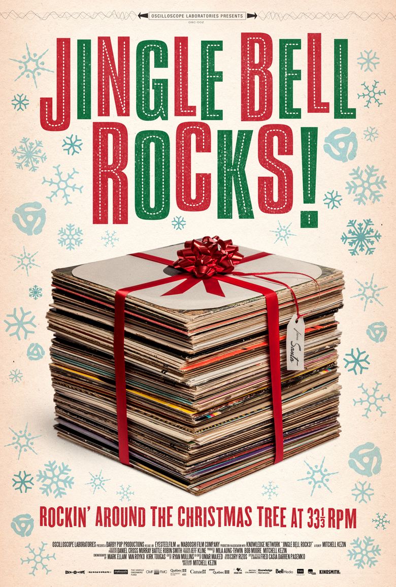 stack of records wrapped in red ribbon with jingle bell rocks in red and green text