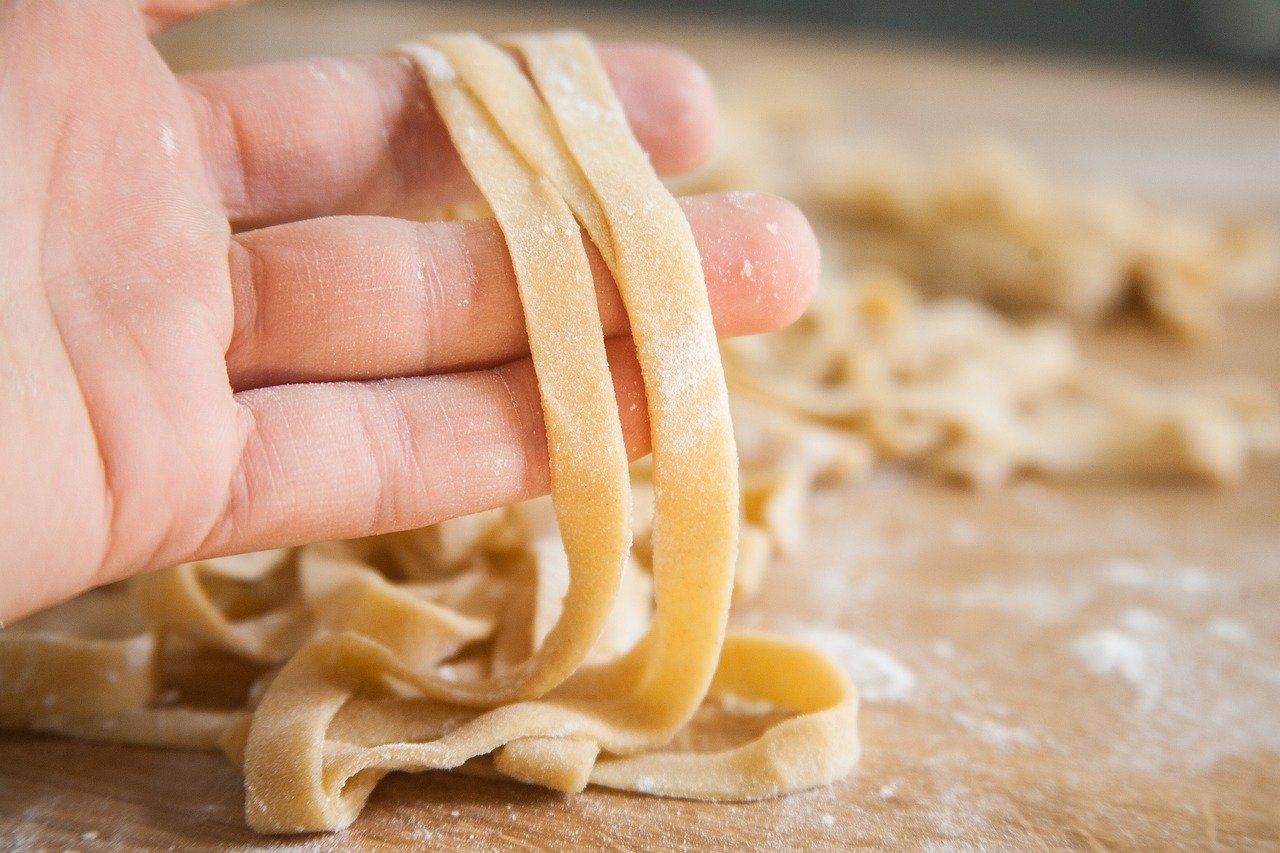 pasta draped over hand