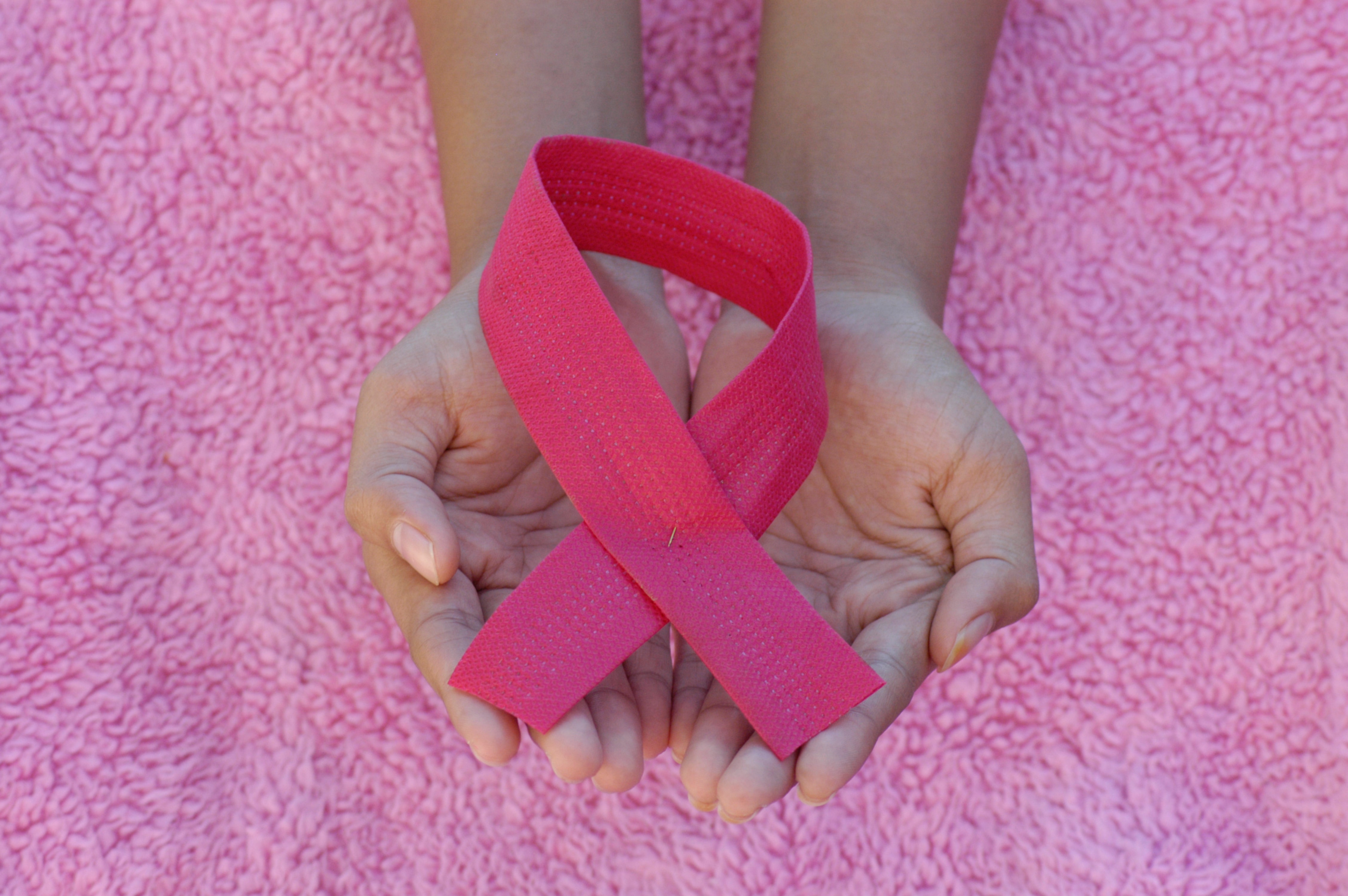 hands holding breast cancer awareness ribbon