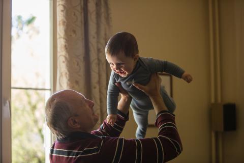 grandfather lifting child