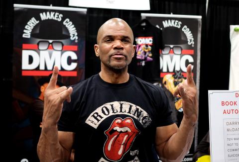 DMC with fingers pointing up