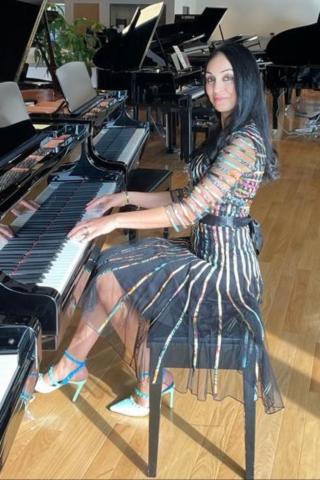 Jenny Feygin at a Grand Piano