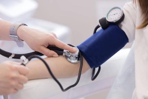 arm with blood pressure monitor on 