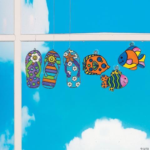 brightly painted sucatchers--flip-flops and tropical fish--hang in a window