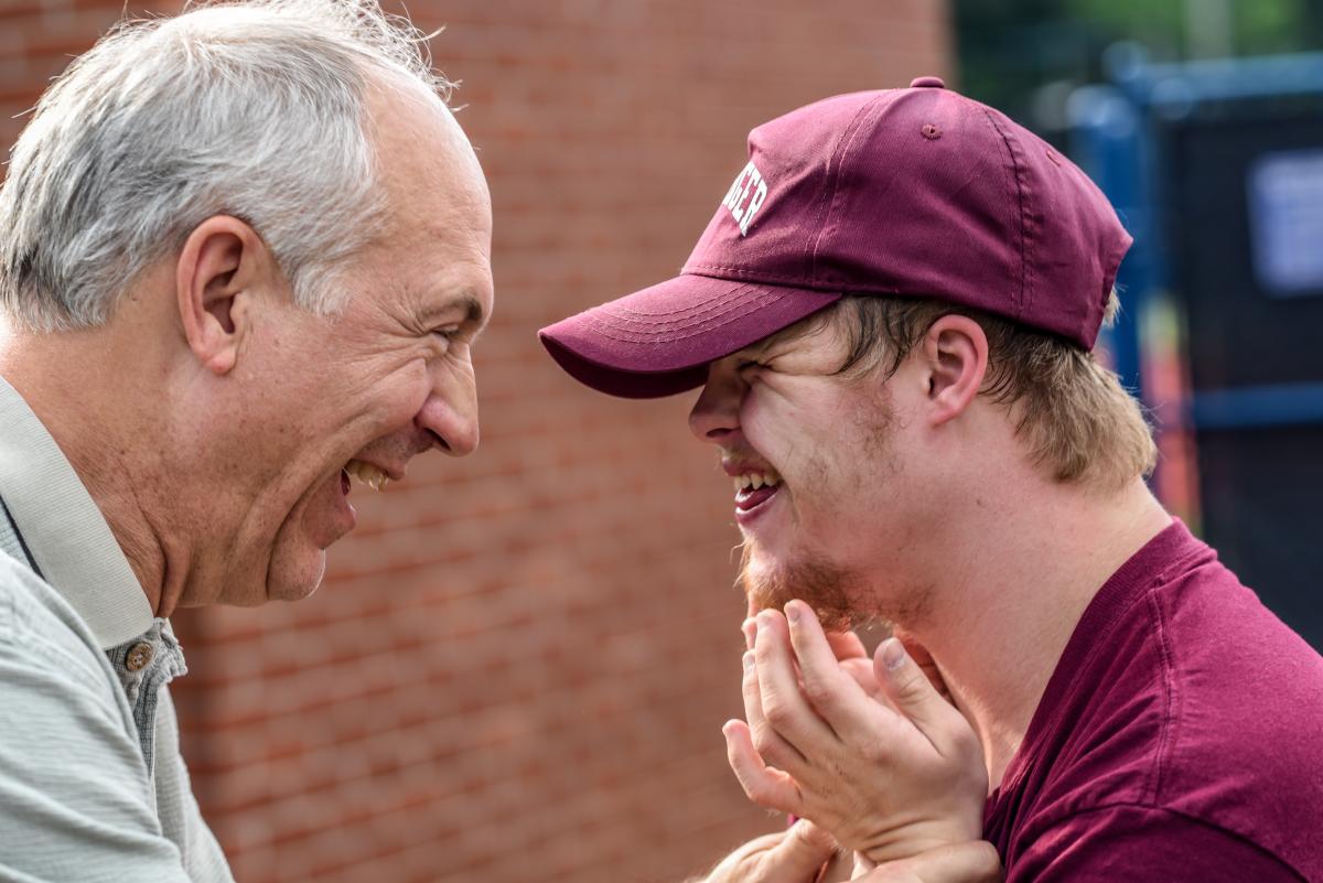 special needs son with father